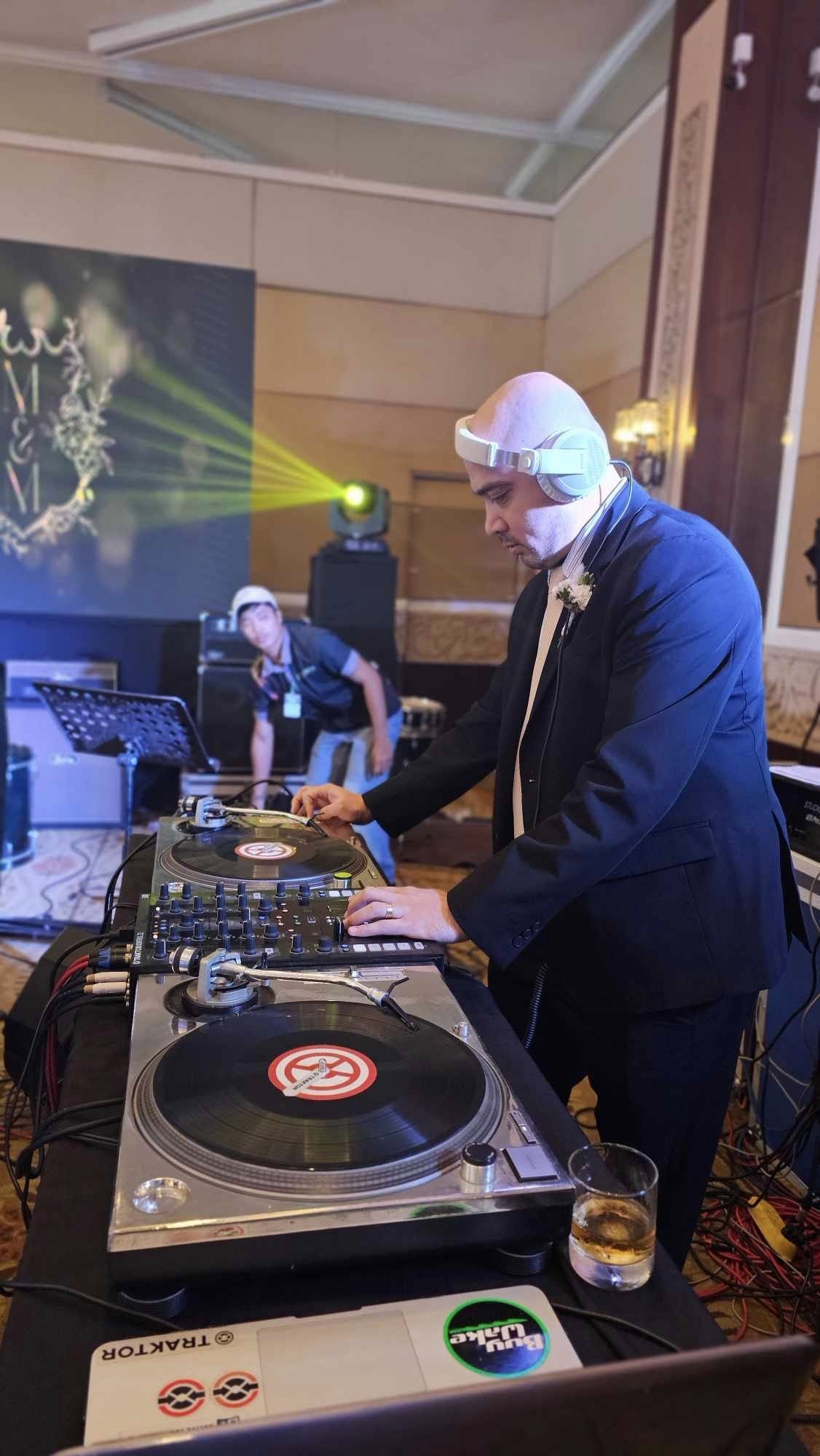 Overhead view of VDJ Maf on Pioneer CDJ decks with neon controls